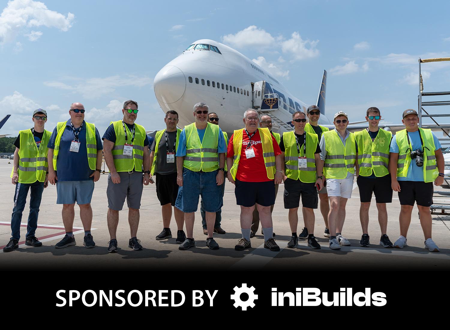 FSExpo attendees stand in front of a Boeing 747 during the 2023 Airside Tour in Houston.